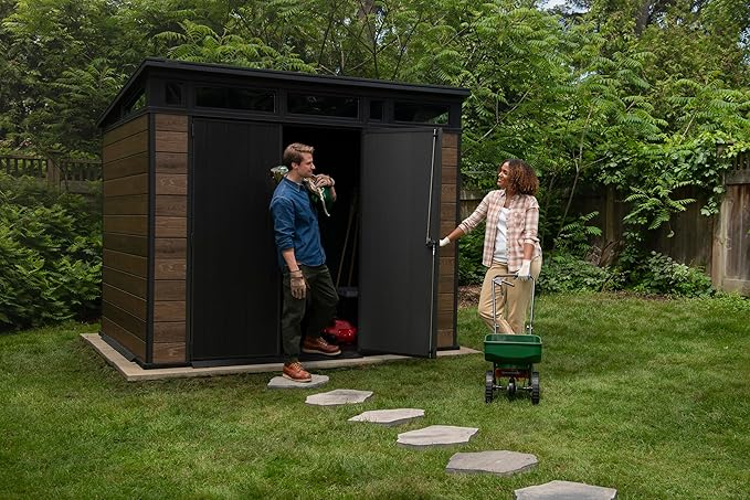 Keter Signature Collection 9x7 Ft All-Weather Storage Shed with Skylight, Window, Built-in Ventilation, Customizable Walls, & Lockable Double Doors, Walnut